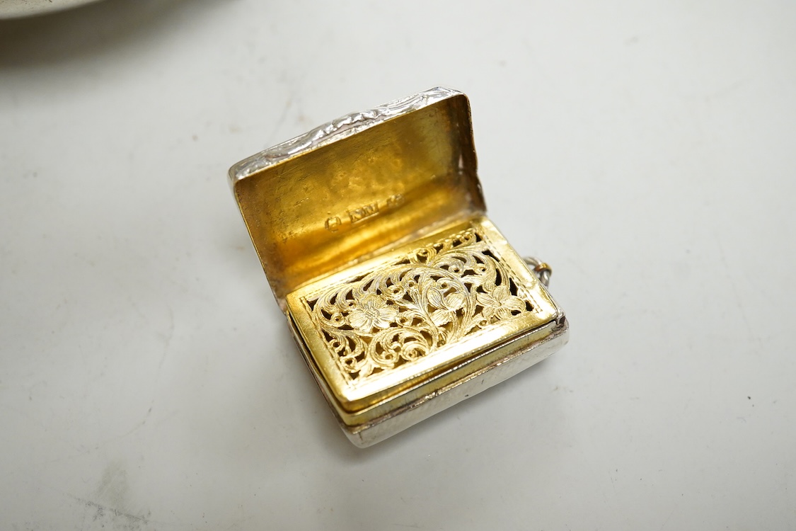 A William IV silver rectangular vinaigrette, by Nathaniel Mills, Birmingham 1830, 30mm(tired), together with a William IV silver pap boat, London, 1832, with later added hallmarked Victorian handle.